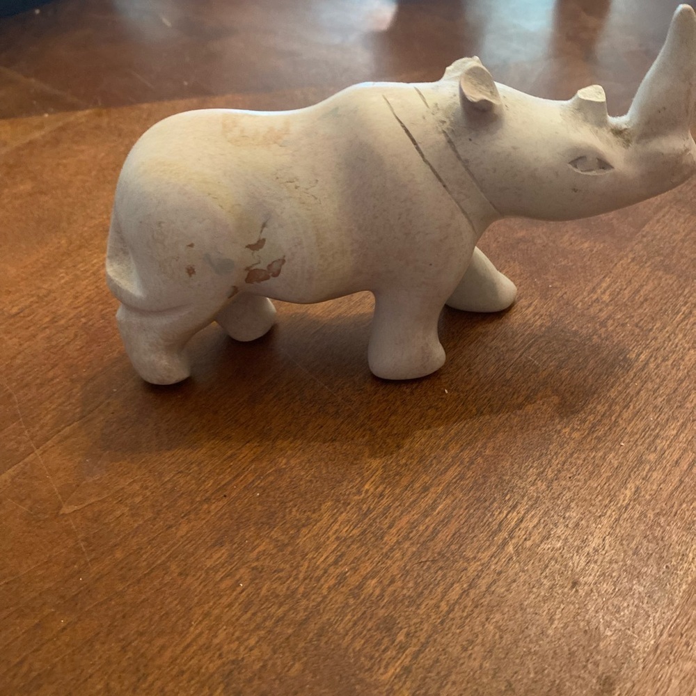 Rhinoceros figure carved of soft stone but the inside horn is broken off. 4x2”
